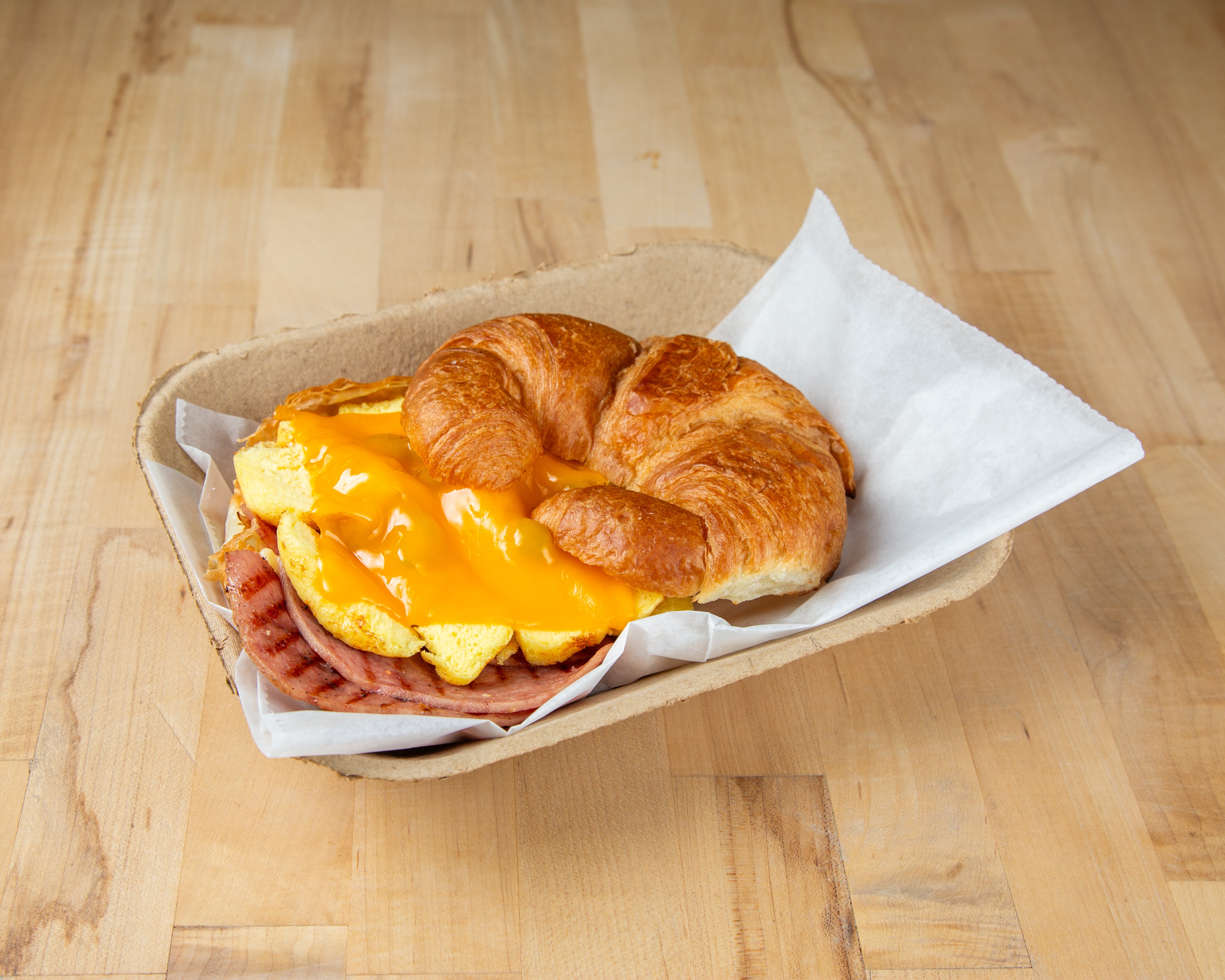 Vaulted breakfast croissant with ham, egg, and cheese