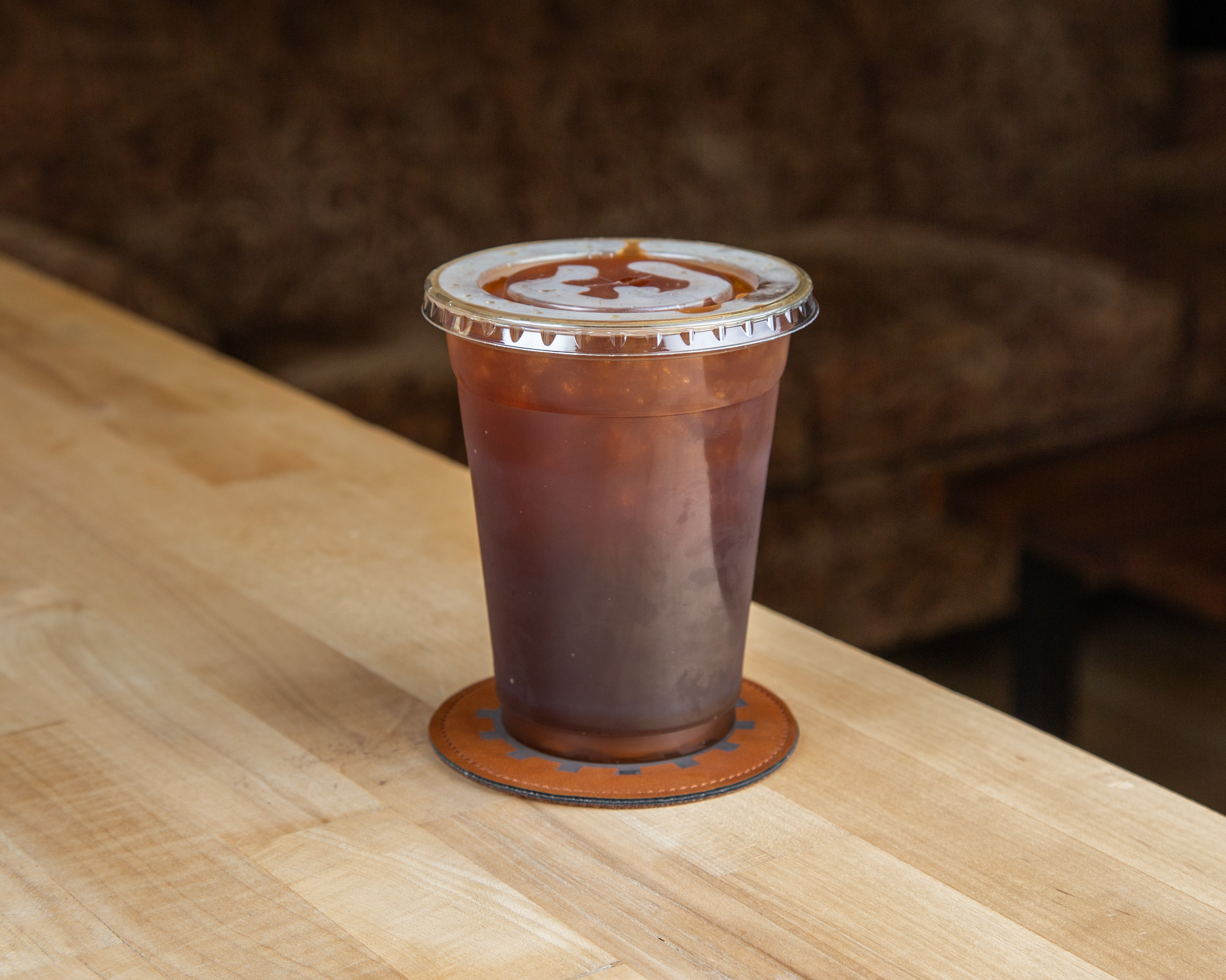 Vault 223 cold brew on a branded coaster