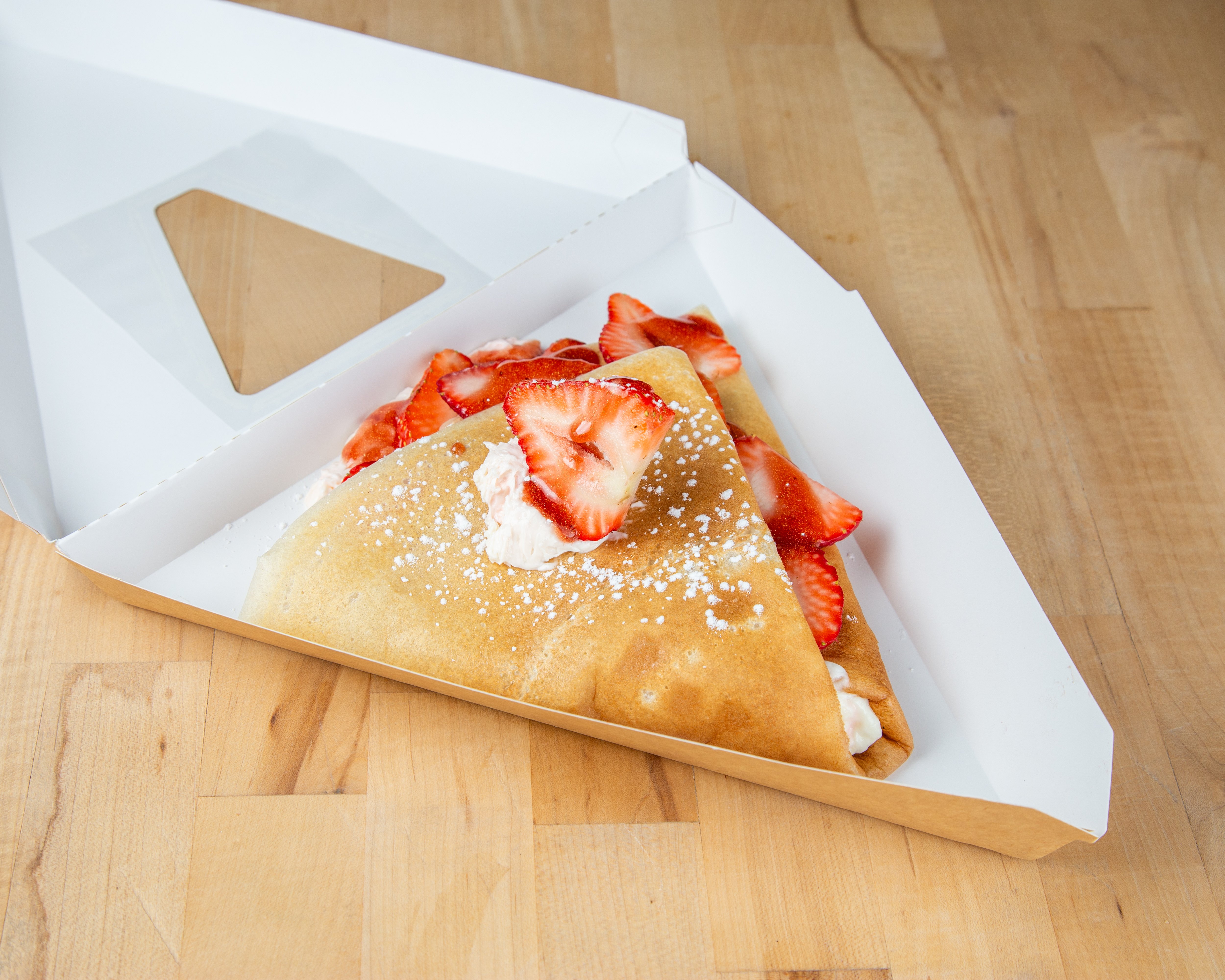 Fresh strawberry cheesecake crepe